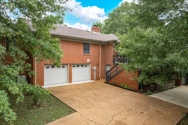 a sitting area with furniture and wooden floor