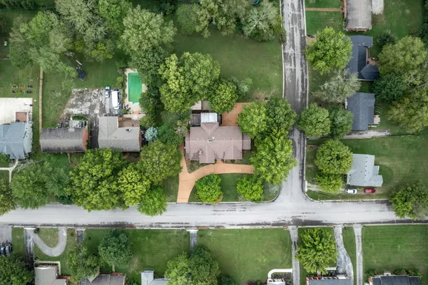a view of house with a tree