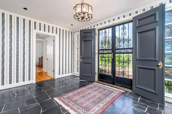 a view of an entryway with a rug
