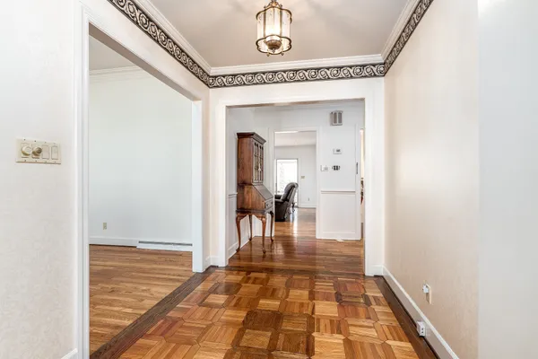 a view of a hallway view with wooden floor