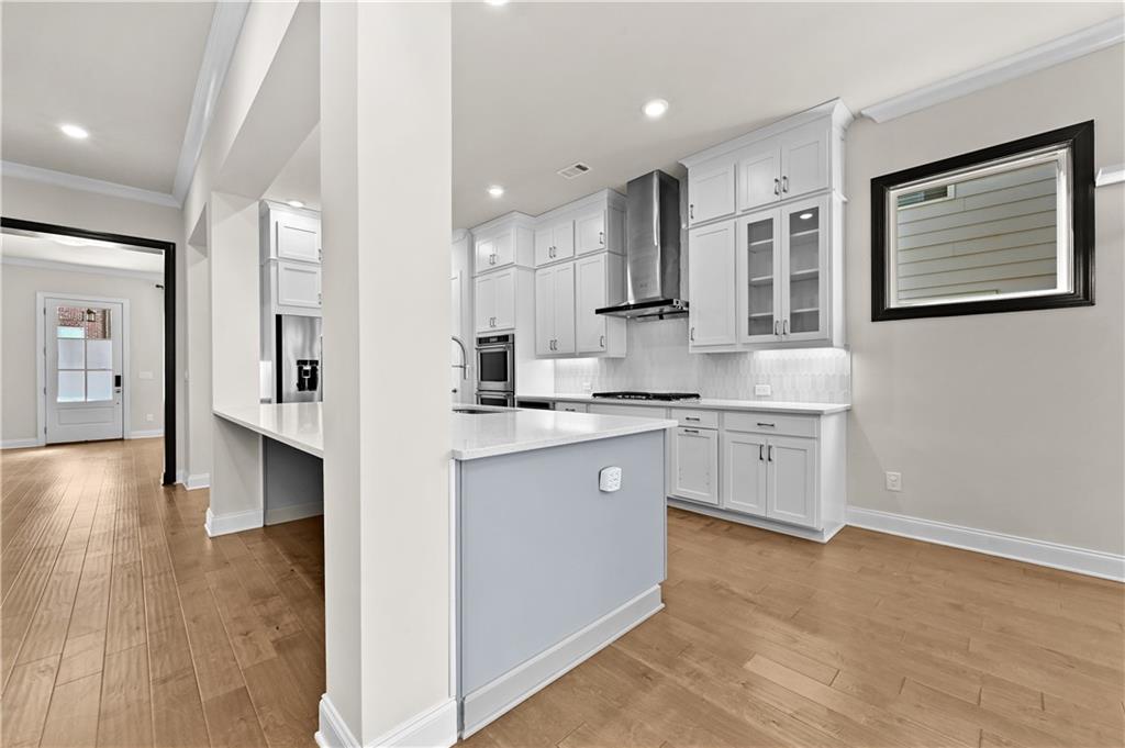 3475 Benedict Place Suwanee, GA 30024 - Photo 13 of 42 a kitchen with white cabinets and sink
