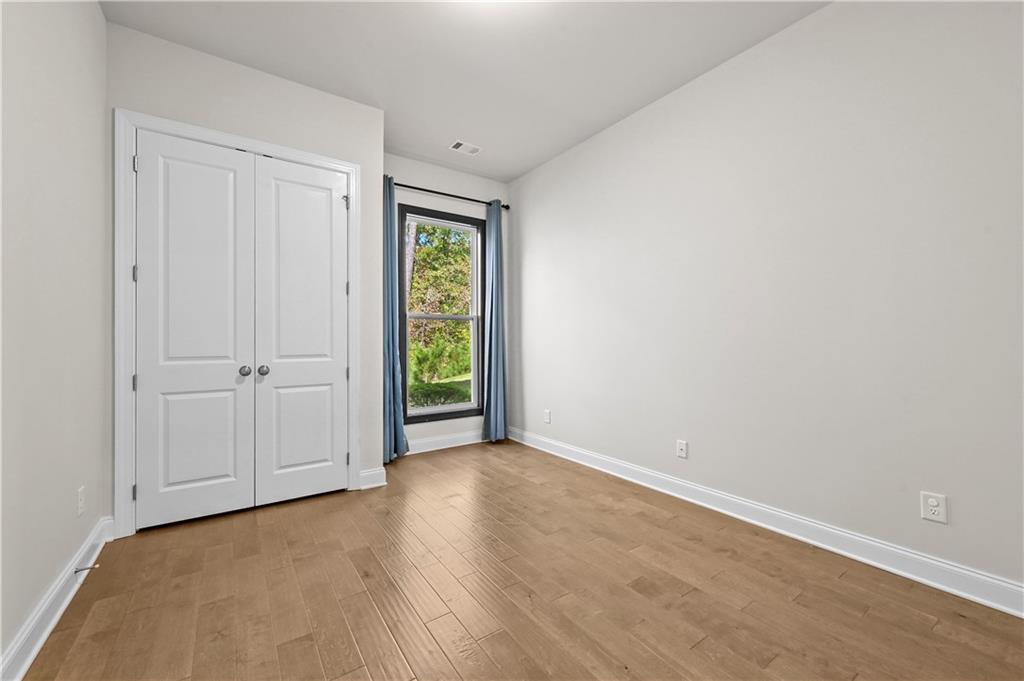 3475 Benedict Place Suwanee, GA 30024 - Photo 20 of 42 a view of an empty room and window