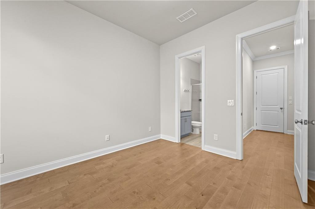 3475 Benedict Place Suwanee, GA 30024 - Photo 21 of 42 wooden floor and closet in a room