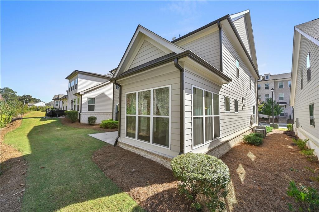 3475 Benedict Place Suwanee, GA 30024 - Photo 40 of 42 a view of a house with a yard