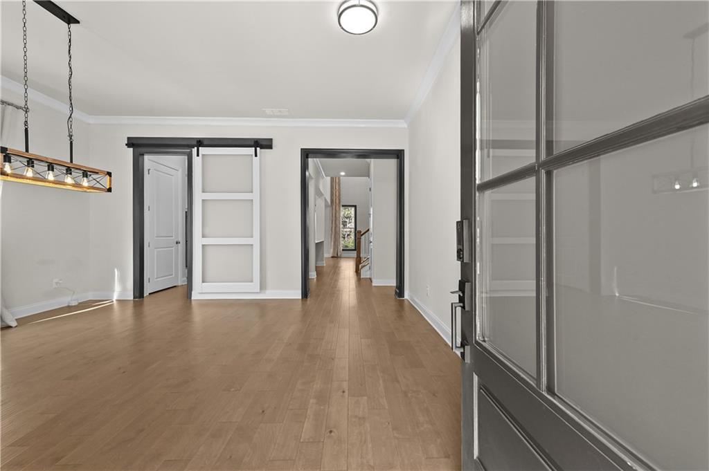 3475 Benedict Place Suwanee, GA 30024 - Photo 5 of 42 a view of an entryway with wooden floor