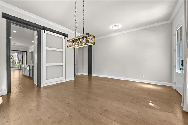 a view of an empty room with a chandelier