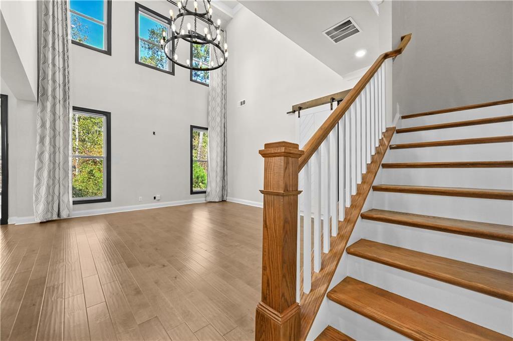 3475 Benedict Place Suwanee, GA 30024 - Photo 9 of 42 a view of an entryway with wooden floor