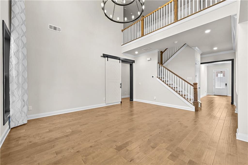 3475 Benedict Place Suwanee, GA 30024 - Photo 10 of 42 a view of a hallway with staircase