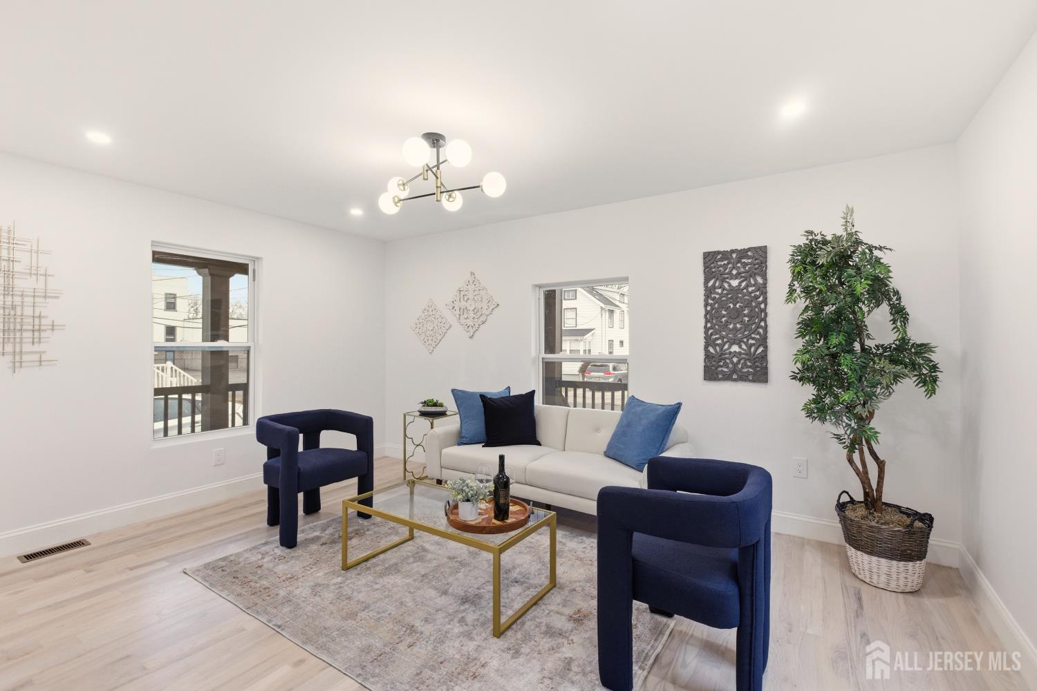 23 Morse Avenue Edison, NJ 08817 - Photo 13 of 31 a living room with furniture potted plant and a window
