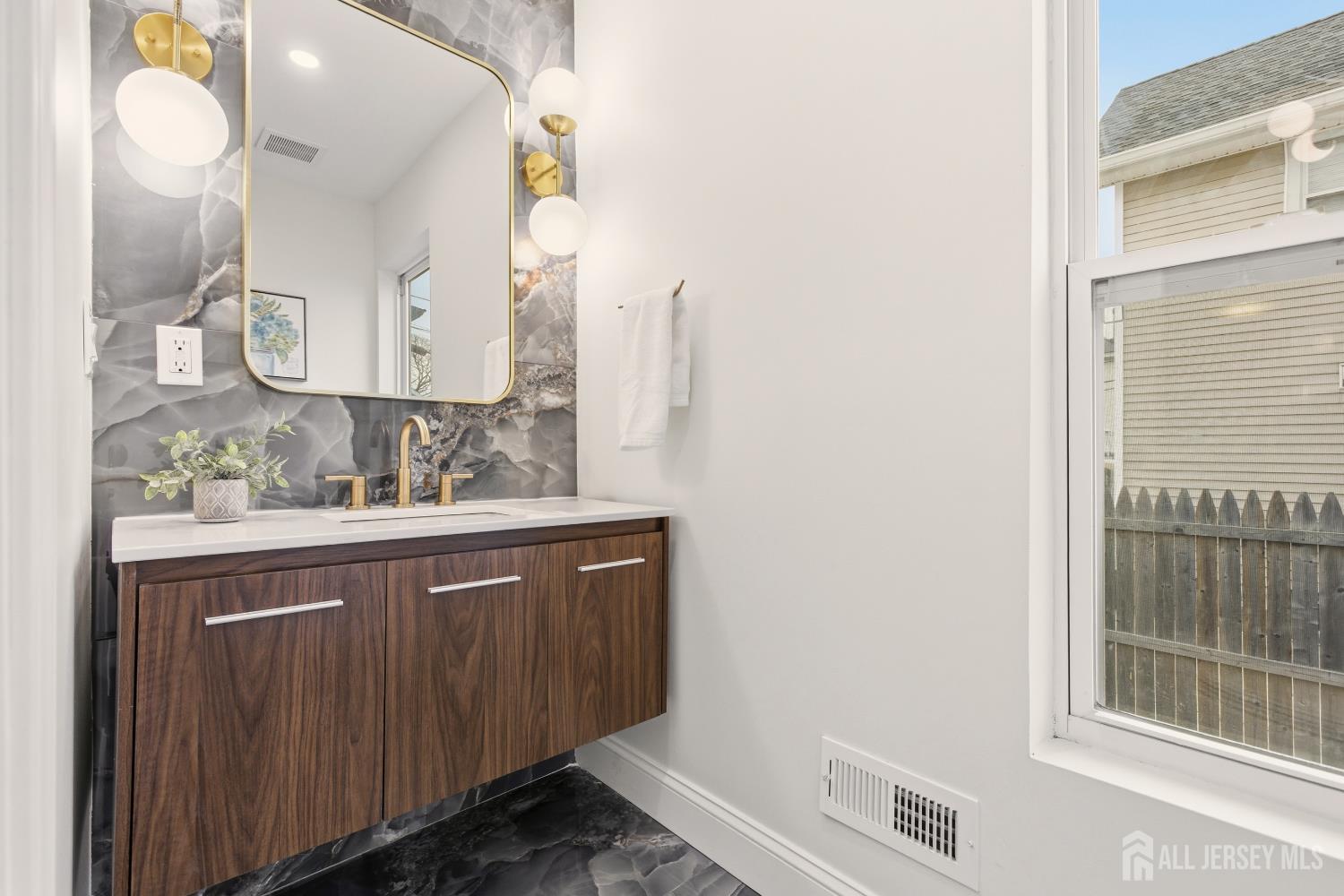 23 Morse Avenue Edison, NJ 08817 - Photo 14 of 31 a bathroom with a sink and a mirror