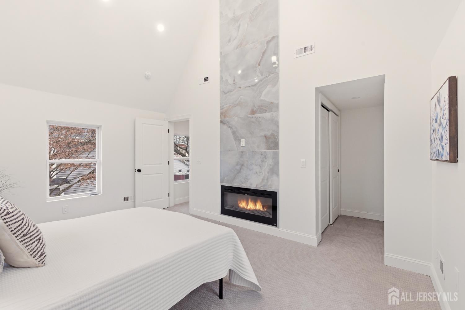 23 Morse Avenue Edison, NJ 08817 - Photo 16 of 31 a bedroom with a bed and a fireplace