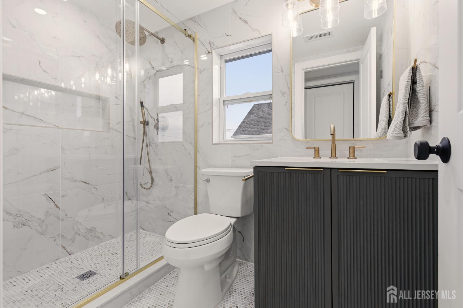 23 Morse Avenue Edison, NJ 08817 - Photo 17 of 31 a bathroom with a double vanity sink toilet and shower