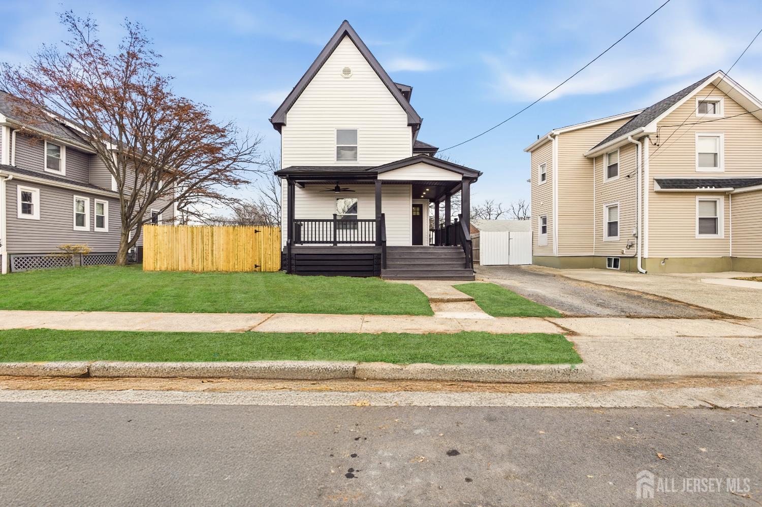23 Morse Avenue Edison, NJ 08817 - Photo 3 of 31 a front view of a house with a yard and garage