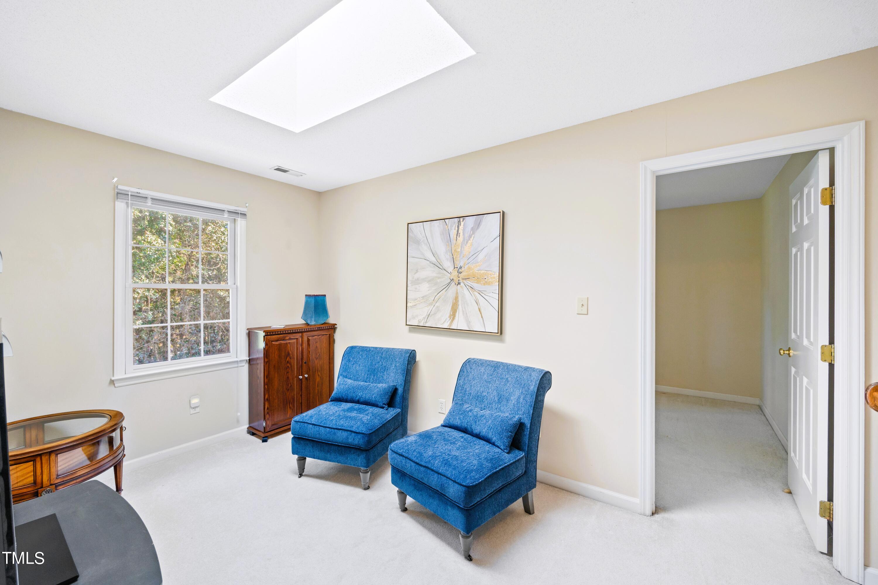 2109 Cedarbluff Court Raleigh, NC 27615 - Photo 25 of 35 a living room with furniture and a window