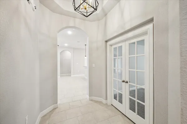 a view of a hallway with white walls