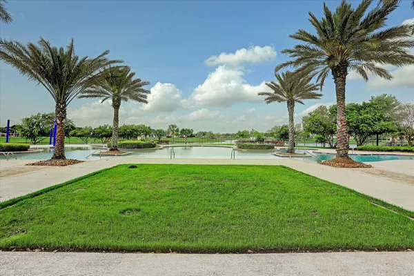 a view of a swimming pool and a yard