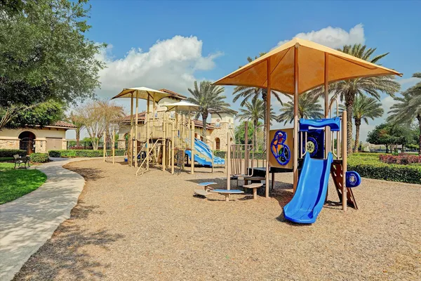 a view of a park with swings and slides