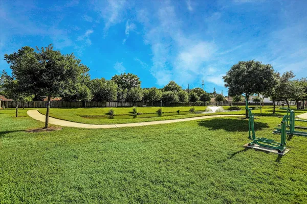a view of a golf course with a lake view