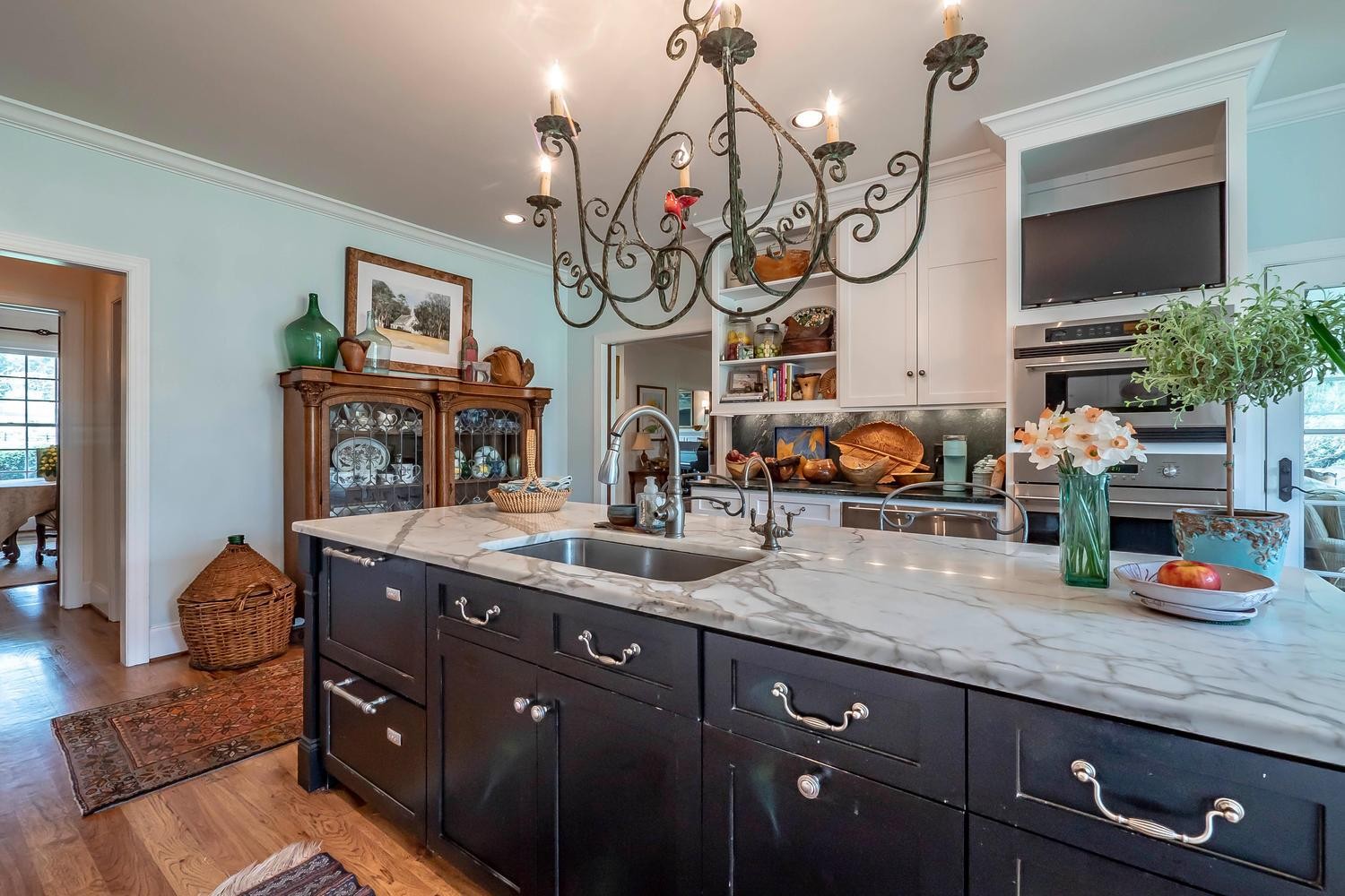 5178 Old Harding Road Franklin, TN 37064 - Photo 11 of 26 a very nice looking kitchen with granite countertop a sink a stove and chairs