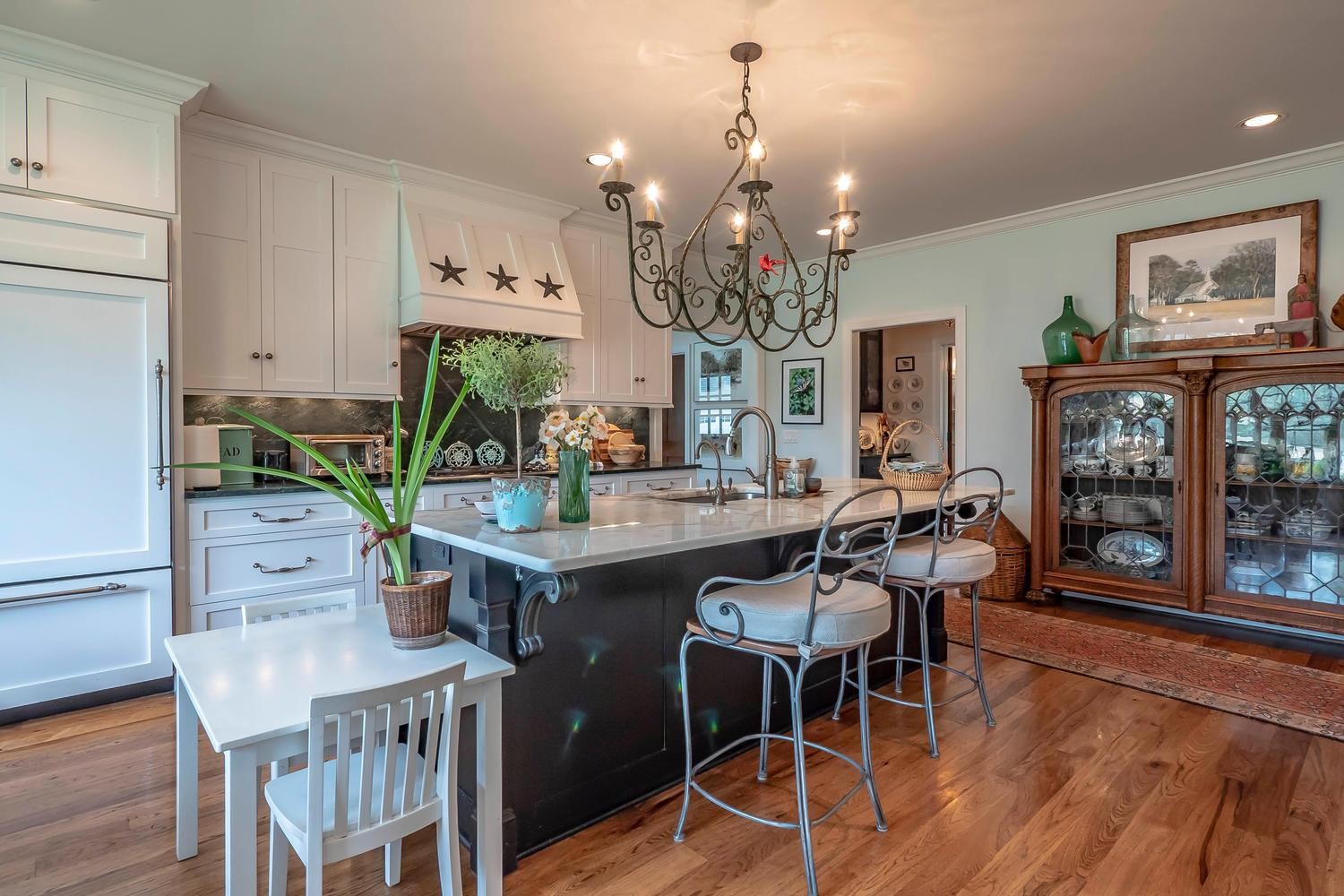 5178 Old Harding Road Franklin, TN 37064 - Photo 12 of 26 a view of a dining room with furniture a chandelier and wooden floor