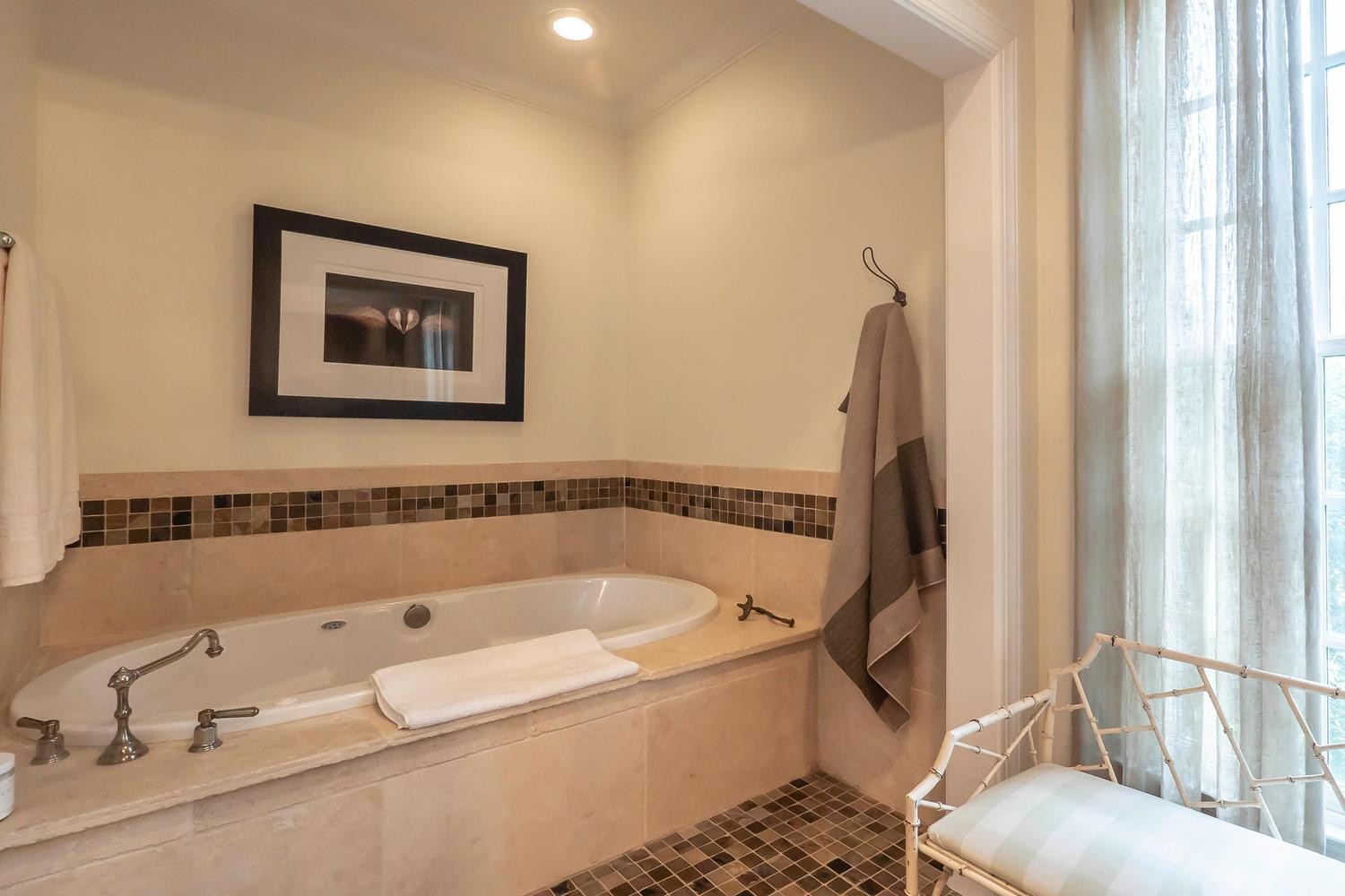 5178 Old Harding Road Franklin, TN 37064 - Photo 18 of 26 a bathroom with a tub and a shower