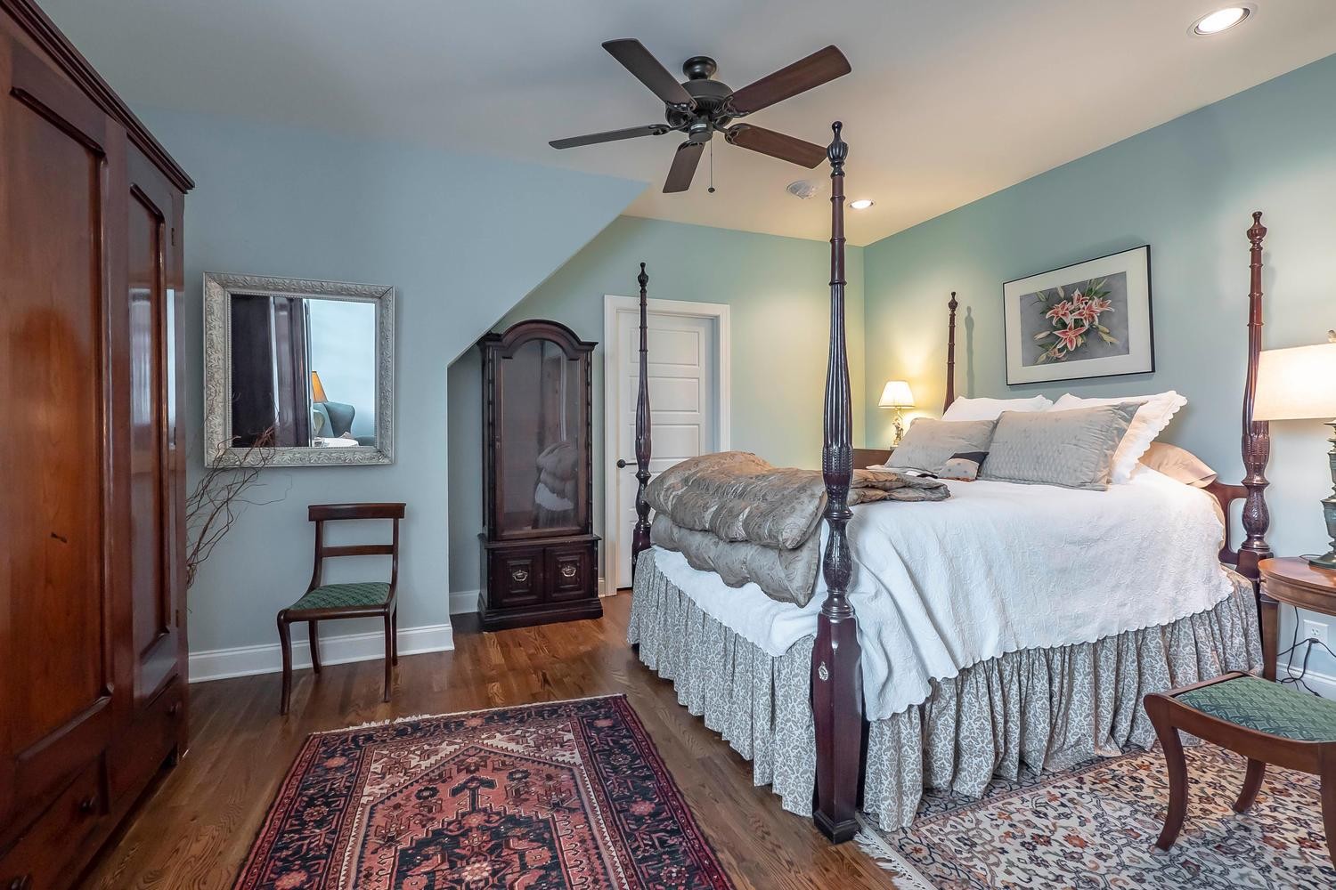 5178 Old Harding Road Franklin, TN 37064 - Photo 21 of 26 a bedroom with a bed and a chandelier