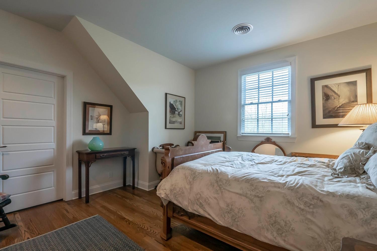 5178 Old Harding Road Franklin, TN 37064 - Photo 22 of 26 a bedroom with a bed and a dresser next to a window
