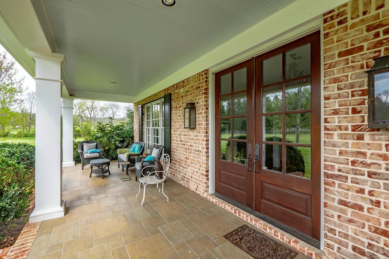 5178 Old Harding Road Franklin, TN 37064 - Photo 4 of 26 a view of a chairs and table in a porch