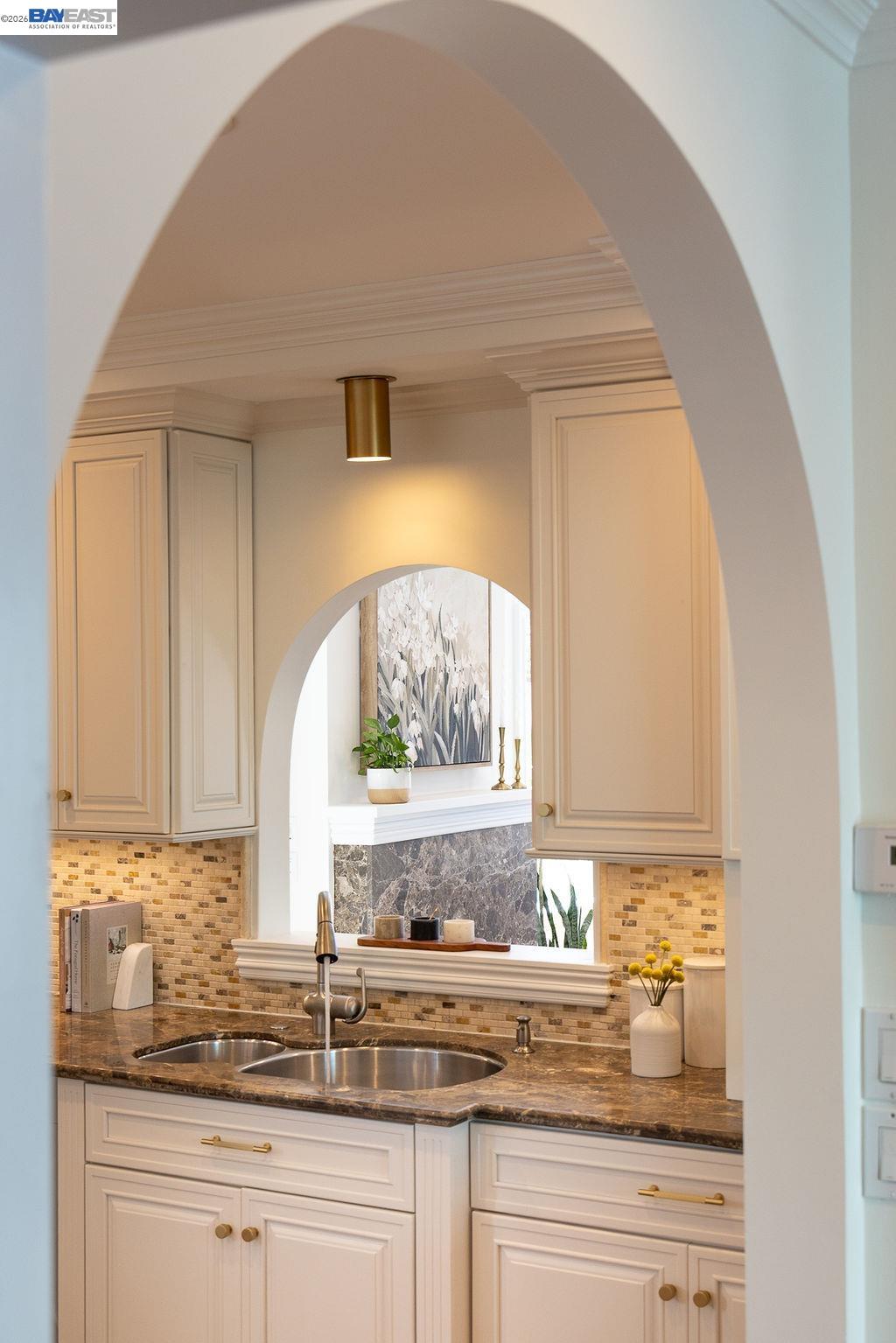 1329 Ordway Street Berkeley, CA 94702 - Photo 19 of 47 a kitchen with granite countertop white cabinets and a window