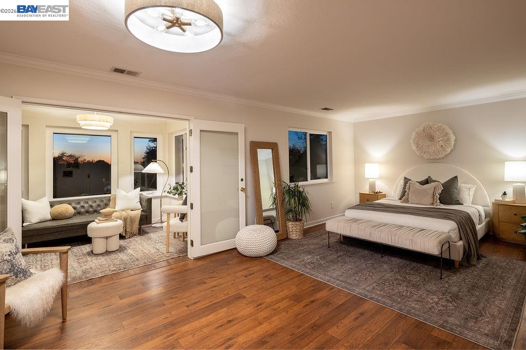 1329 Ordway Street Berkeley, CA 94702 - Photo 24 of 47 a bedroom with furniture and wooden floor