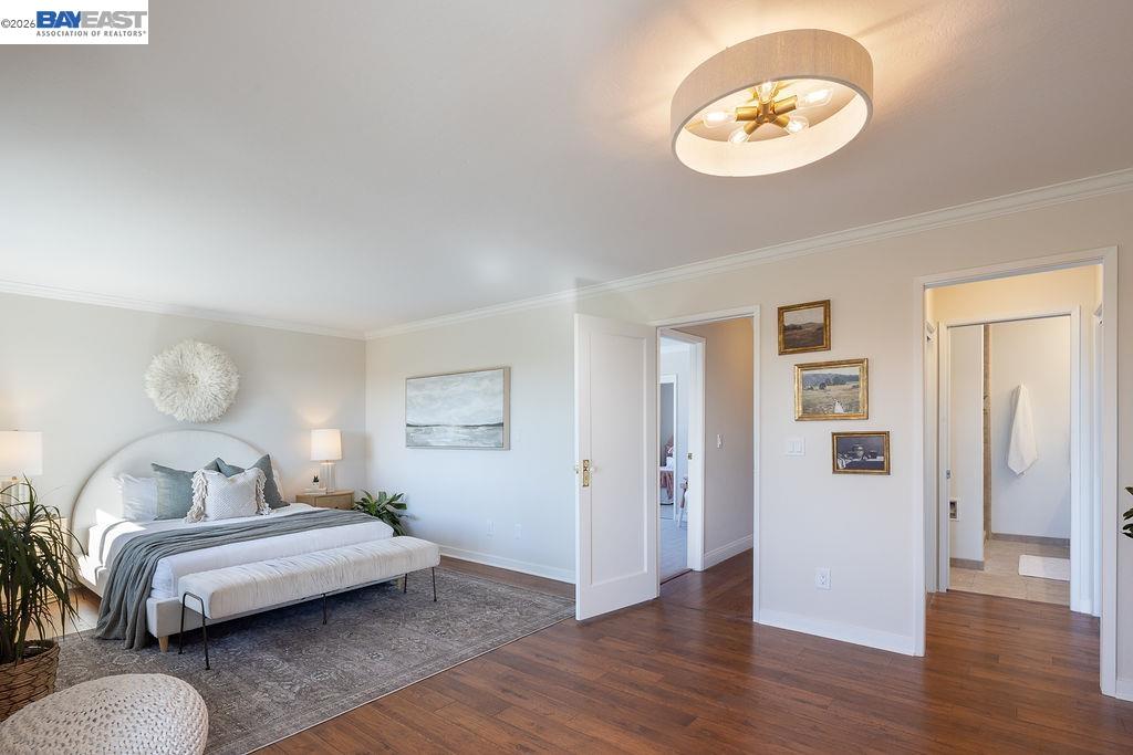 1329 Ordway Street Berkeley, CA 94702 - Photo 26 of 47 a bedroom with a bed and wooden floor