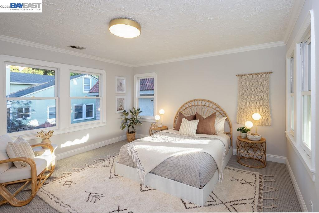 1329 Ordway Street Berkeley, CA 94702 - Photo 29 of 47 a bedroom with a bed and wooden floor