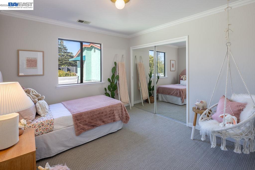 1329 Ordway Street Berkeley, CA 94702 - Photo 31 of 47 a spacious bedroom with a bed and a window