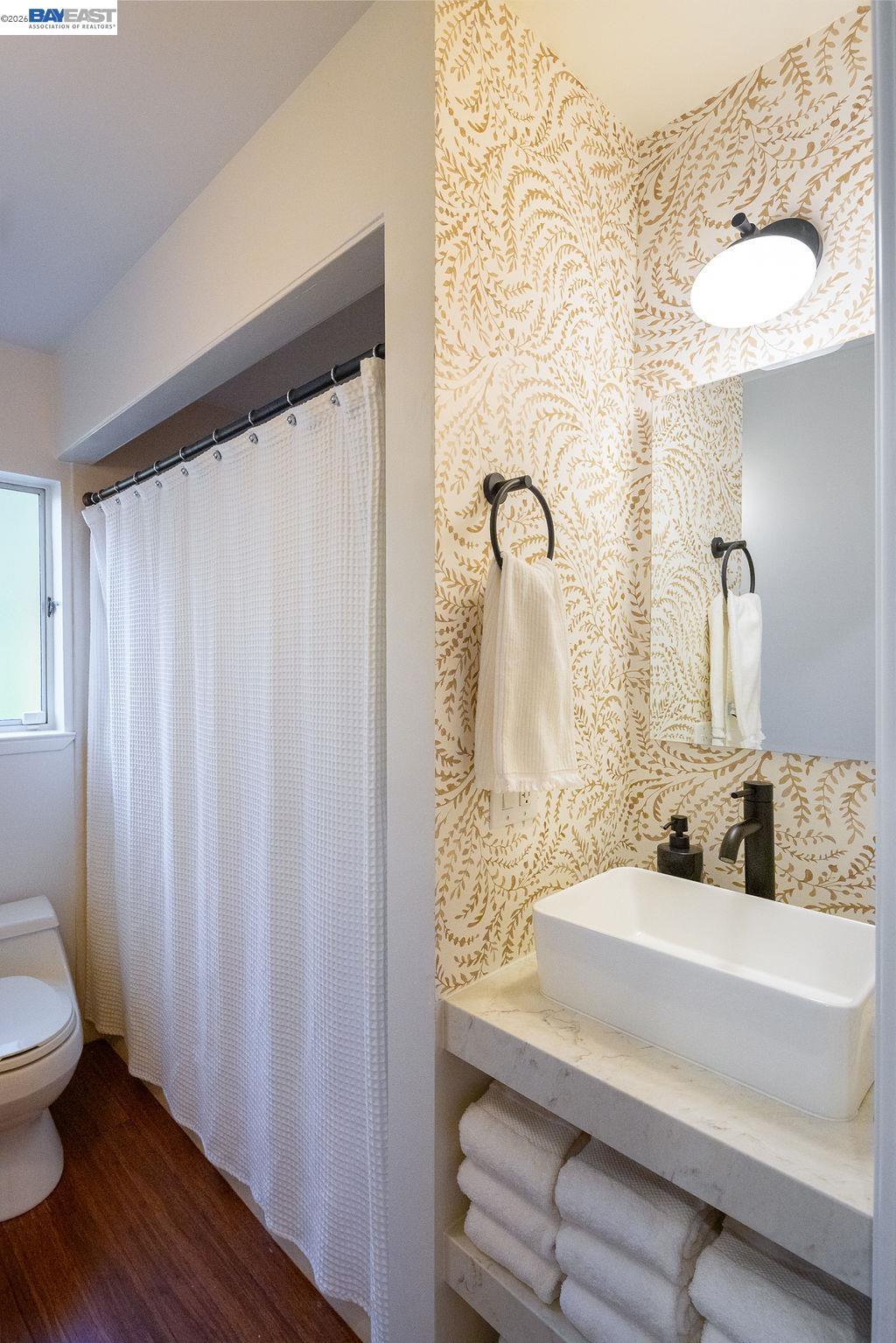 1329 Ordway Street Berkeley, CA 94702 - Photo 32 of 47 a bathroom with a sink and a mirror