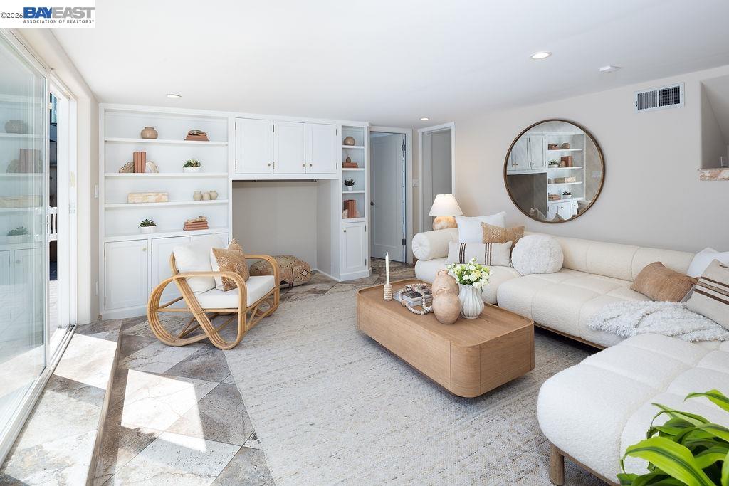 1329 Ordway Street Berkeley, CA 94702 - Photo 34 of 47 a living room with furniture a rug and a window