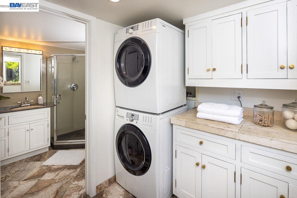 1329 Ordway Street Berkeley, CA 94702 - Photo 36 of 47 a utility room with sink dryer and washer