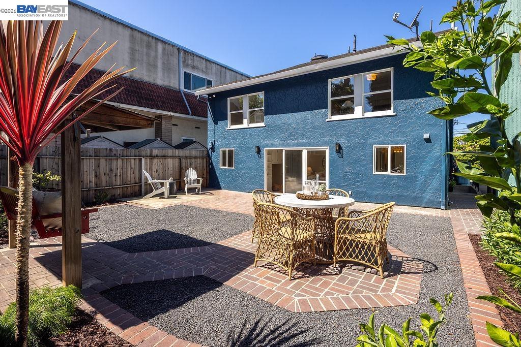 1329 Ordway Street Berkeley, CA 94702 - Photo 40 of 47 a view of a patio with couches table and chairs and potted plants