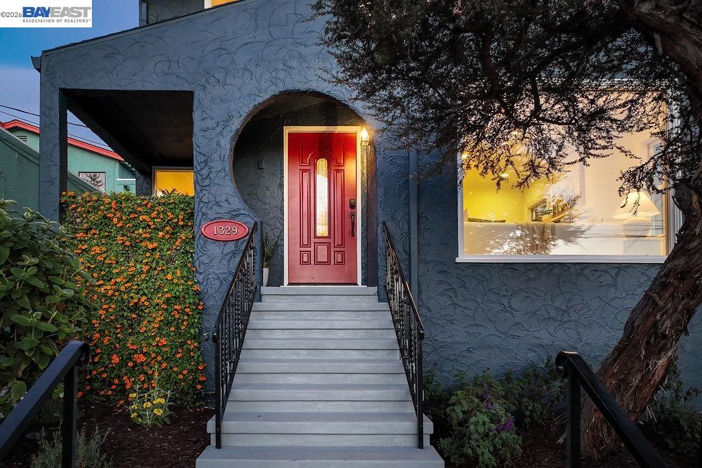 1329 Ordway Street Berkeley, CA 94702 - Photo 5 of 47 a front view of a house with a garden