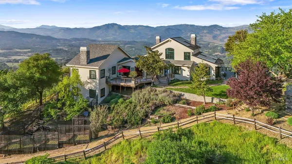 a view of a terrace with a yard and mountain view