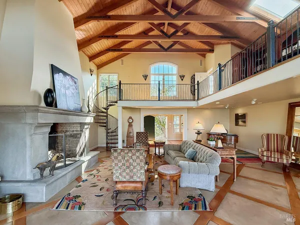 a view of a dining room with furniture wooden floor and chandelier