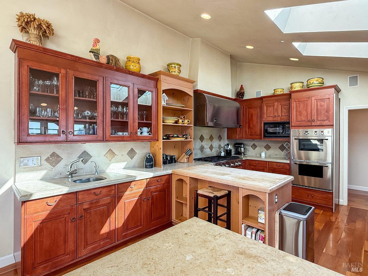 1000 Wolf Ridge Road Glen Ellen, CA 95442 - Photo 27 of 70 a kitchen with stainless steel appliances granite countertop a sink and cabinets