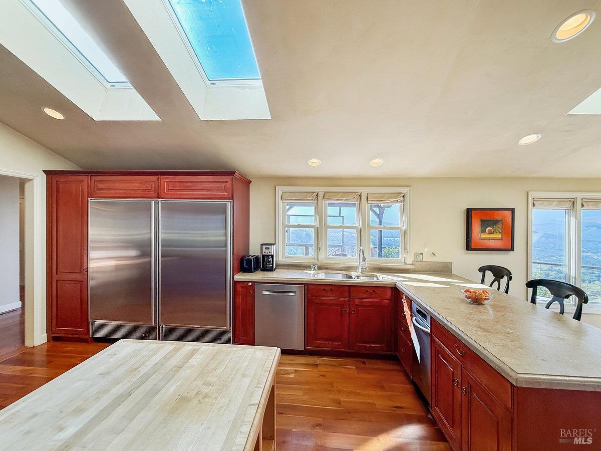 1000 Wolf Ridge Road Glen Ellen, CA 95442 - Photo 29 of 70 a large kitchen with stainless steel appliances granite countertop a sink and a refrigerator