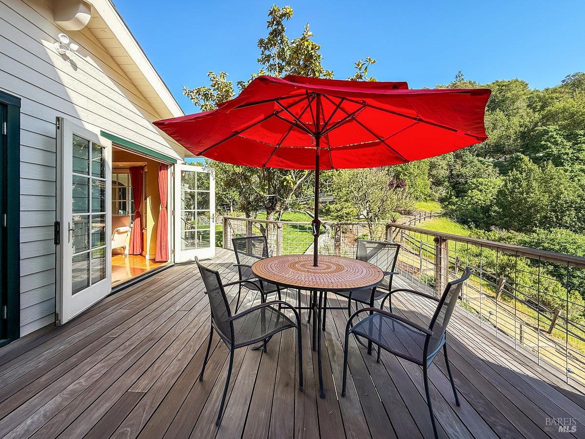 1000 Wolf Ridge Road Glen Ellen, CA 95442 - Photo 38 of 70 a view of balcony with outdoor seating and wooden floor