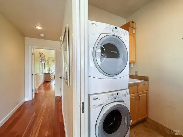 a view of a fountain with flower plants in front of main door