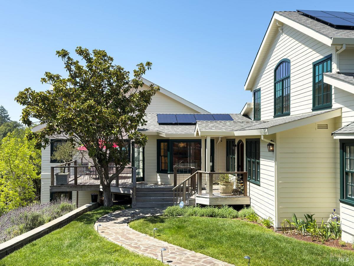 1000 Wolf Ridge Road Glen Ellen, CA 95442 - Photo 4 of 70 a front view of a house with a yard table and chairs