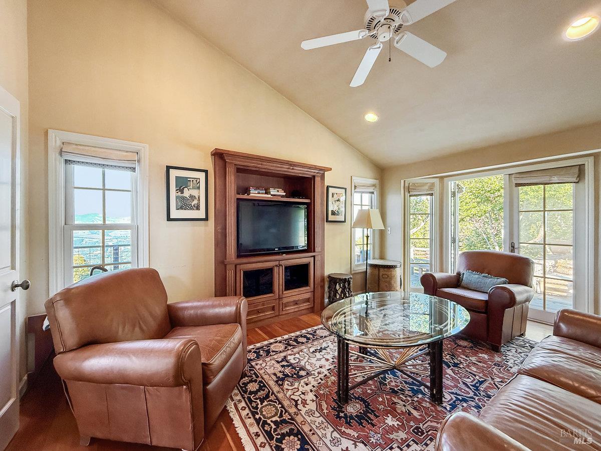 1000 Wolf Ridge Road Glen Ellen, CA 95442 - Photo 51 of 70 a living room with furniture a flat screen tv and a large window