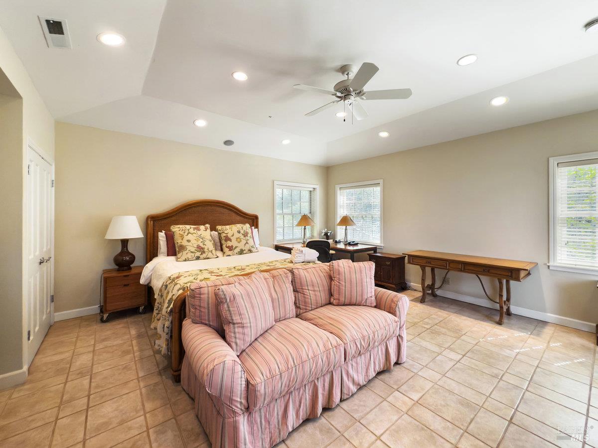 1000 Wolf Ridge Road Glen Ellen, CA 95442 - Photo 59 of 70 a bedroom with a bed and a table