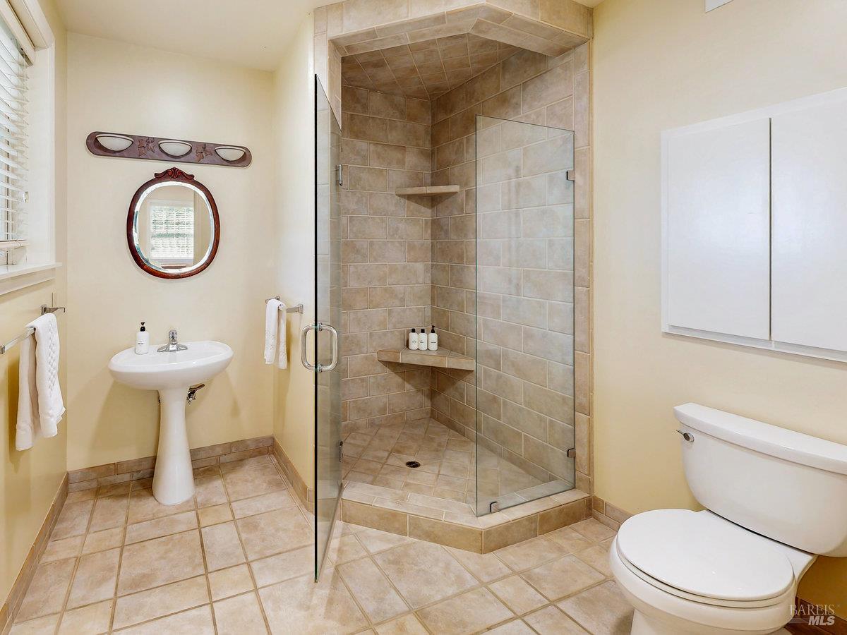 1000 Wolf Ridge Road Glen Ellen, CA 95442 - Photo 61 of 70 a bathroom with a sink toilet and shower