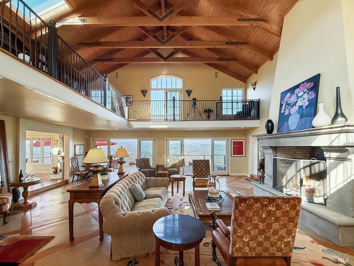 1000 Wolf Ridge Road Glen Ellen, CA 95442 - Photo 7 of 70 a living room with furniture a rug and kitchen view