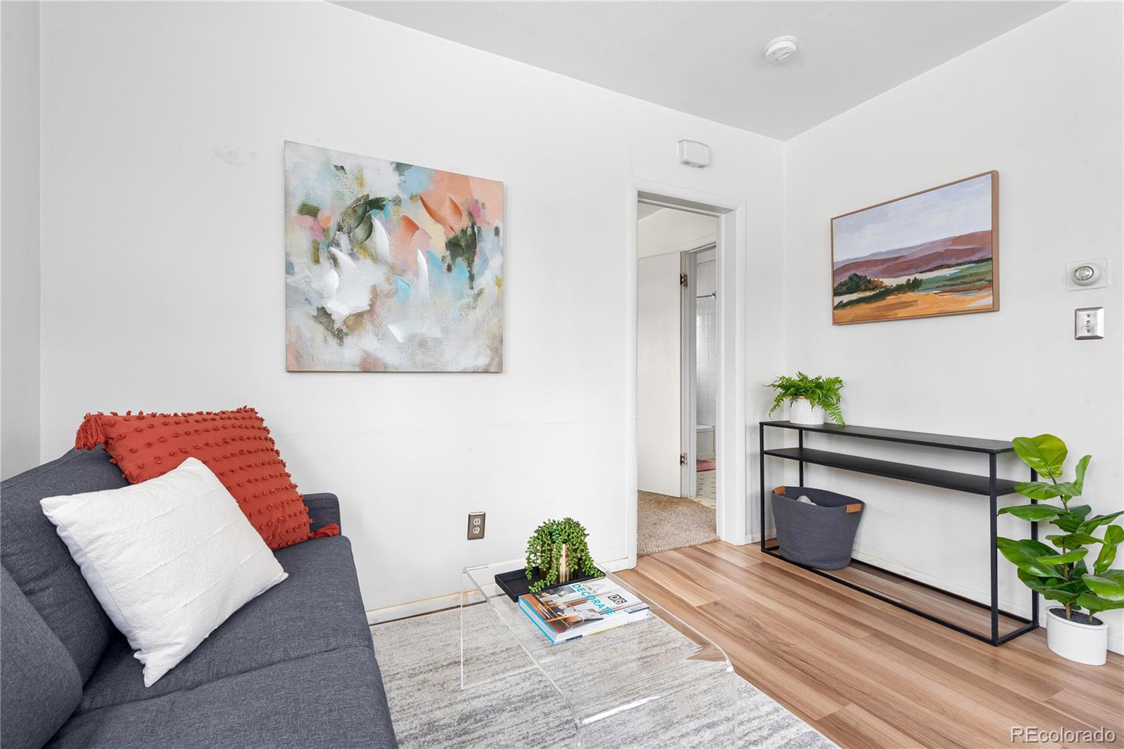 4151 Zenobia Street Denver, CO 80212 - Photo 12 of 31 a living room with furniture and wooden floor